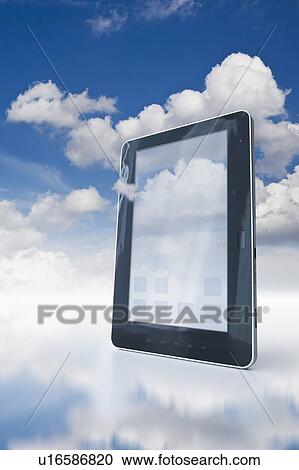 Stock Image - Digital tablet floating in clouds. Fotosearch