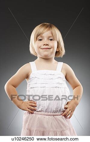 Girl (2-3) with hands on hip and looking at camera, studio shot View Large Photo Image Stock Image - Girl (2-3) with hands on hip and looking at camera, studio shot. Fotosearch