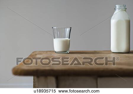 Stock Photography - Glass and bottle of milk. Fotosearch