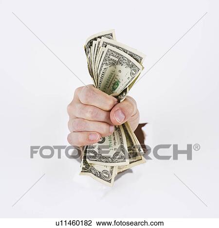 Stock Image - Hand on white background holding banknotes. Fotosearch