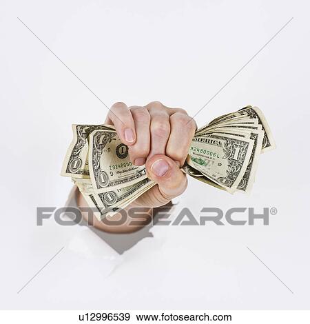 Stock Photo - Hand on white background holding banknotes. Fotosearch