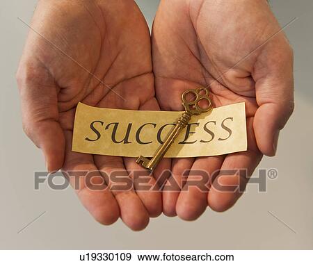 Hands holding key and label reading Success View Large Photo Image Stock Photo - Hands holding key and label reading Success. Fotosearch