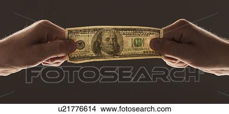Hands holding one hundred dollar bill View Large Photo Image Picture - Hands holding one hundred dollar bill. Fotosearch