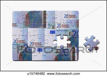 Stock Image - Jigsaw Puzzle with euro notes. Fotosearch
