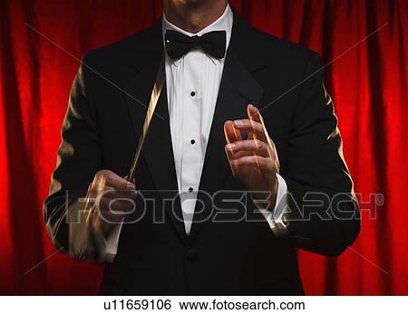 Stock Photograph - Midsection of orchestra conductor. Fotosearch