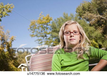 Outdoor portrait of blonde USA, Utah, girl (8-9) in glasses View Large Photo Image Stock Photograph - Outdoor portrait of blonde USA, Utah, girl (8-9) in glasses. Fotosearch
