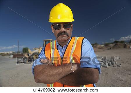 Portrait of construction worker on building site View Large Photo Image Stock Image - Portrait of construction worker on building site. Fotosearch