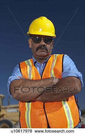 Stock Photo - Portrait of construction worker on building site. Fotosearch