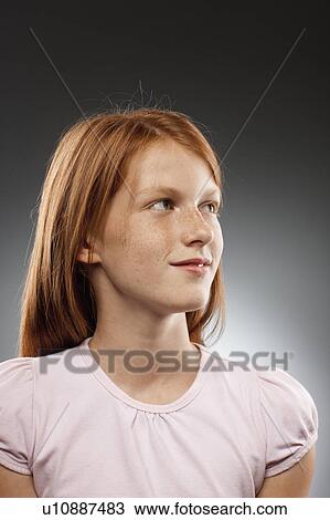 Portrait of redhead girl (10-11) looking away, studio shot View Large Photo Image Stock Image - Portrait of redhead girl (10-11) looking away, studio shot. Fotosearch