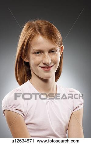 Portrait of redhead girl (10-11), studio shot View Large Photo Image Stock Image - Portrait of redhead girl (10-11), studio shot. Fotosearch