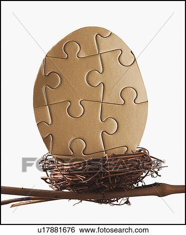 Stock Photograph - Puzzle egg in bird's nest. Fotosearch