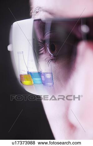 Reflection of chemical flasks in female scientists glasses View Large Photo Image Stock Photo - Reflection of chemical flasks in female scientists glasses. Fotosearch