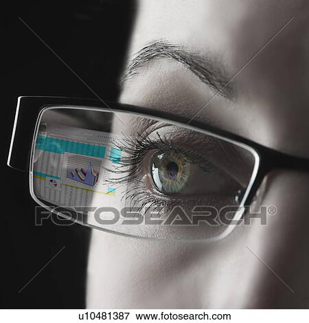 Stock Photo - Reflection of graph in businesswoman's glasses. Fotosearch