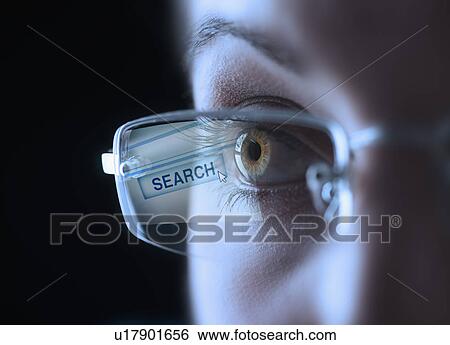 Stock Photograph - Reflection of search button in businesswoman's glasses. Fotosearch