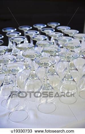 Rows of wine glasses on table View Large Photo Image Stock Image - Rows of wine glasses on table . Fotosearch