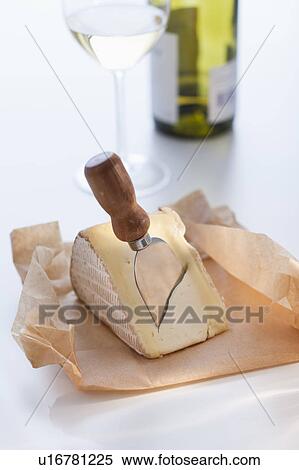 Slice of brie with cheese knife View Large Photo Image Stock Photography - Slice of brie with cheese knife. Fotosearch