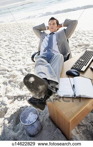 South Africa, Businessman relaxing on beach View Large Photo Image Stock Photo - South Africa, Businessman relaxing on beach. Fotosearch