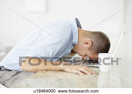 South Africa, Man with forehead on his laptop View Large Photo Image Stock Image - South Africa, Man with forehead on his laptop. Fotosearch
