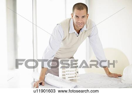 Stock Image - South Africa, Portrait of smiling architect. Fotosearch