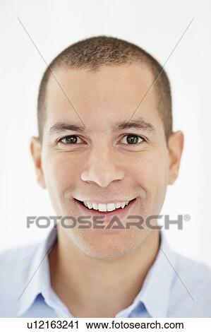 Stock Image - South Africa, Portrait of smiling young man. Fotosearch