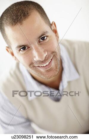 Stock Image - South Africa, Portrait of smiling young man. Fotosearch