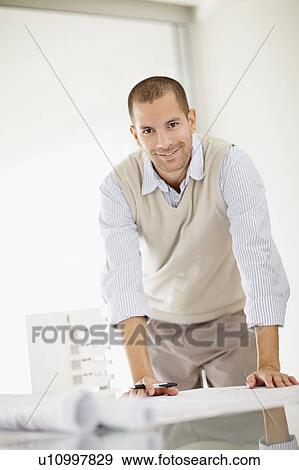 South Africa, Smiling architect working in office, portrait View Large Photo Image Stock Photo - South Africa, Smiling architect working in office, portrait. Fotosearch