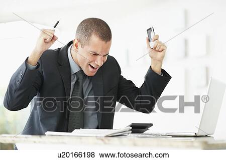 South Africa, Young happy businessman in office View Large Photo Image Stock Photo - South Africa, Young happy businessman in office. Fotosearch