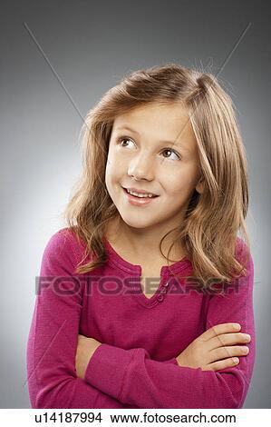 Studio portrait of girl (10-11) smiling View Large Photo Image Picture - Studio portrait of girl (10-11) smiling. Fotosearch
