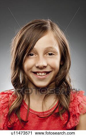 Studio portrait of girl (10-11) smiling View Large Photo Image Stock Image - Studio portrait of girl (10-11) smiling. Fotosearch