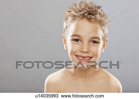 Studio portrait of toothless boy (8-9) smiling View Large Photo Image Stock Image - Studio portrait of toothless boy (8-9) smiling. Fotosearch