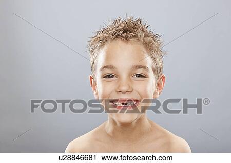 Studio portrait of toothless boy (8-9) smiling View Large Photo Image Stock Image - Studio portrait of toothless boy (8-9) smiling. Fotosearch
