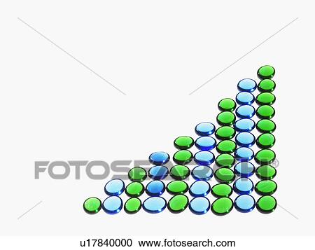 Stock Image - Studio shot of blue and green glass beads in triangle shape. Fotosearch