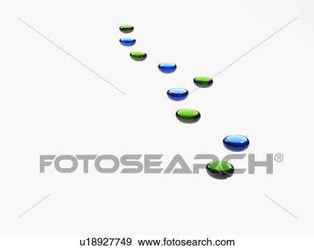 Studio shot of blue and green glass beads in row View Large Photo Image Stock Photo - Studio shot of blue and green glass beads in row. Fotosearch