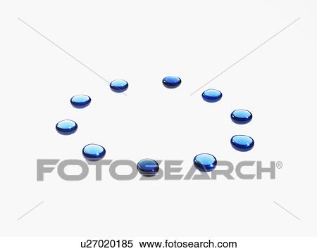 Stock Photography - Studio shot of blue glass beads in circle. Fotosearch