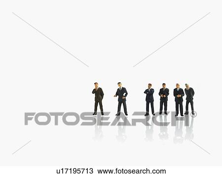 Stock Image - Studio shot of businessman figurines. Fotosearch