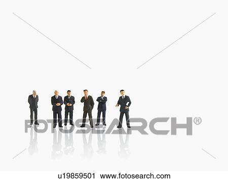 Stock Image - Studio shot of businessman figurines. Fotosearch