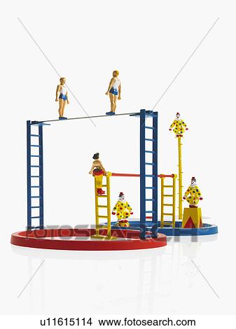 Studio shot of figurines on ladders View Large Photo Image Picture - Studio shot of figurines on ladders. Fotosearch