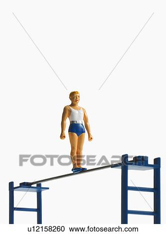 Stock Image - Studio shot of figurines on ladders. Fotosearch
