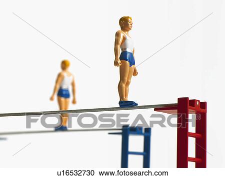 Stock Image - Studio shot of figurines on ladders. Fotosearch