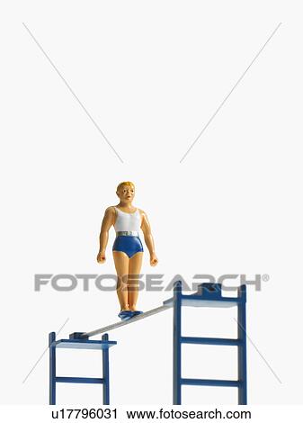 Stock Image - Studio shot of figurines on ladders. Fotosearch