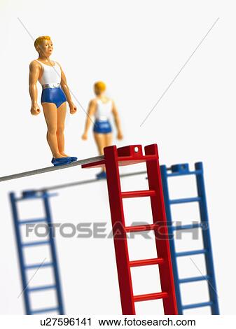 Stock Image - Studio shot of figurines on ladders. Fotosearch