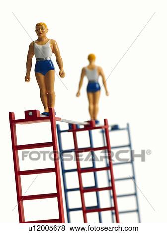 Stock Photo - Studio shot of figurines on ladders. Fotosearch
