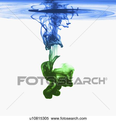 Stock Photography - Studio shot of green and blue dye in abstract shape. Fotosearch