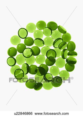 Stock Photograph - Studio shot of green glass beads in sphere. Fotosearch