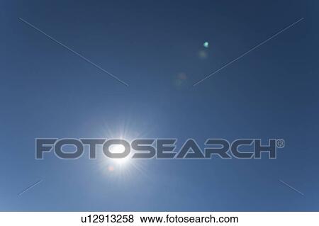 Stock Photo - Sun on clear sky. Fotosearch