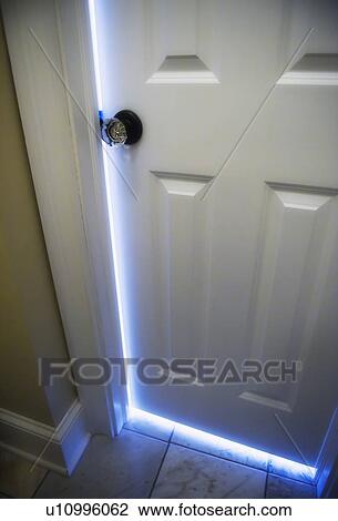 Stock Image - Sunlight shining through open door . Fotosearch