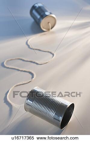 Stock Photography - Tin can phone on white background. Fotosearch