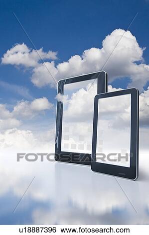 Stock Photograph - Two digital tablets floating in clouds. Fotosearch