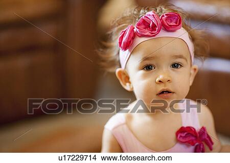 Picture - USA, Arizona, Chandler, Portrait of cute girl (2-3) wearing headband with pink roses. Fotosearch