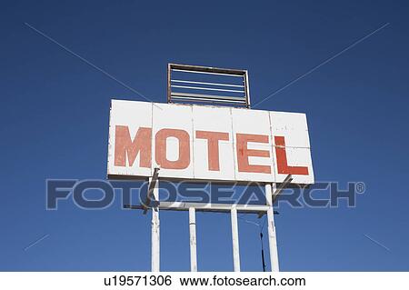 Stock Photograph - USA, Arizona, Holbrook, Motel sign against blue sky. Fotosearch